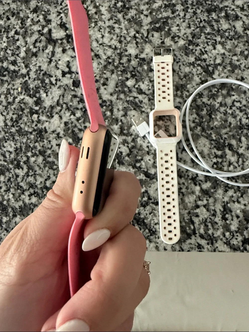 Apple Watch Series 3 with Pink Silicone Band and White Perforated Band
